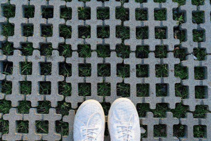 white shoes on grass protection mats