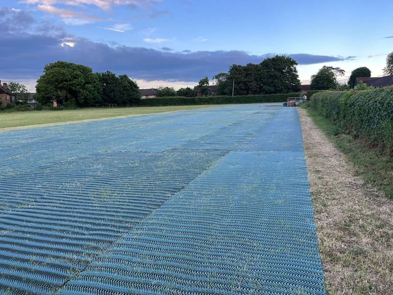 Long view of heavy grass reinforcement mesh installed for farm overflow parking