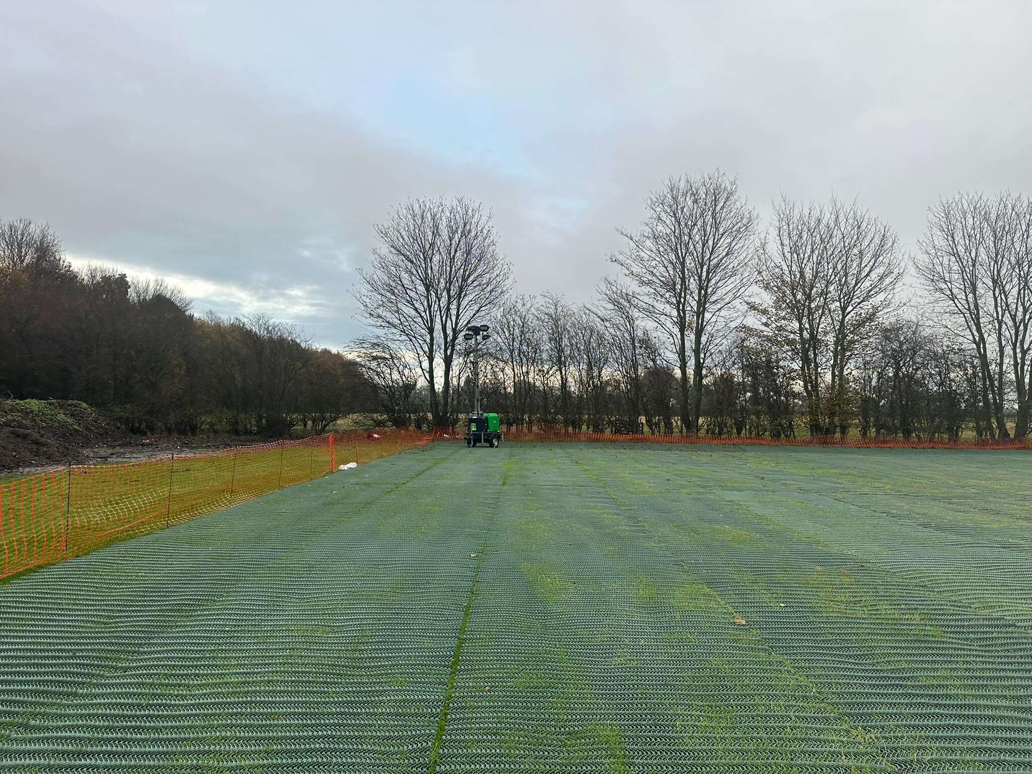 Heavy grass reinforcement mesh installed across a large seasonal parking area at Designer Outlet York