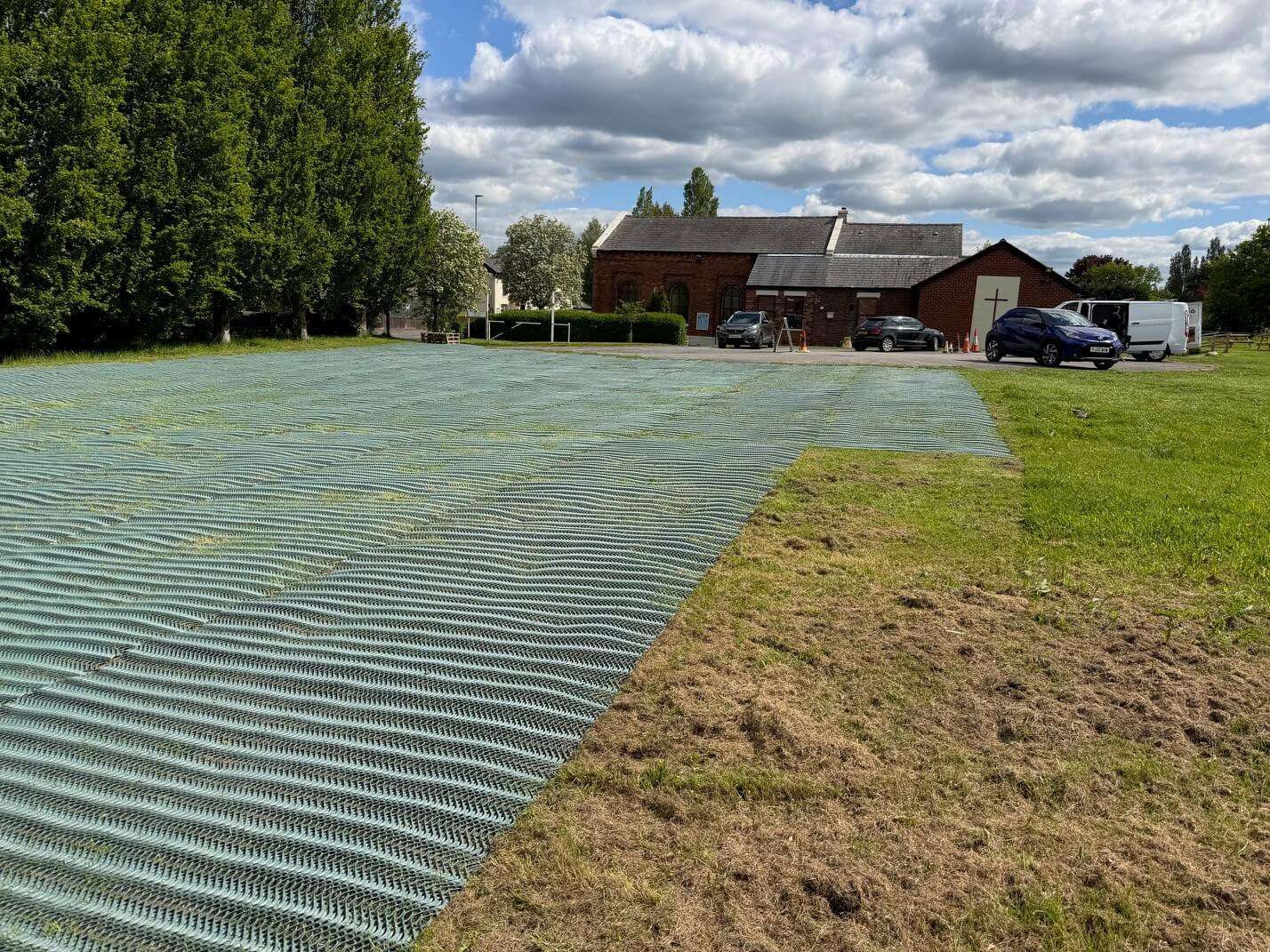 Heavy grass reinforcement mesh laid across a church overflow parking area