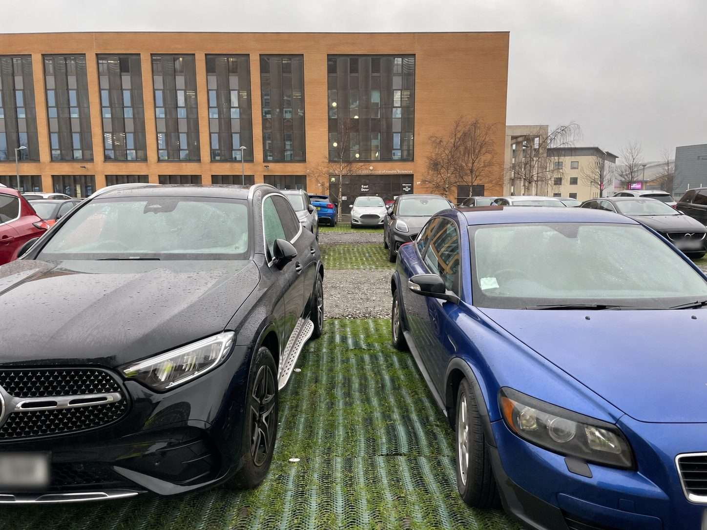 Temporary university staff parking reinforced with heavy grass mesh