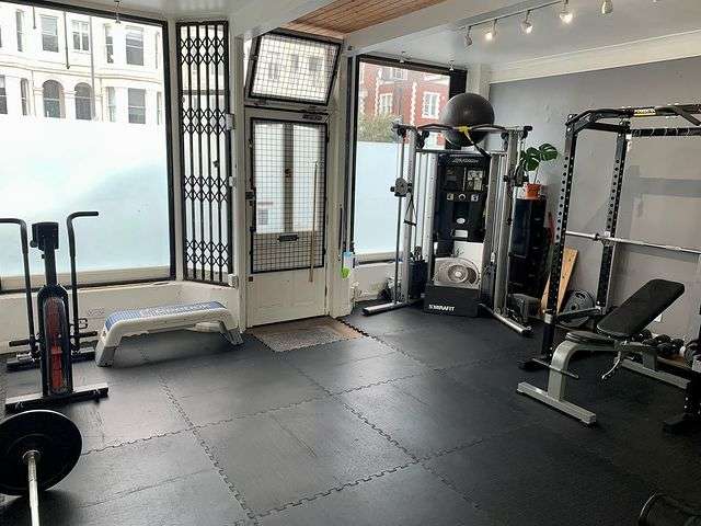 Interlocking Mega Gym Tiles installed in a clean gym training area