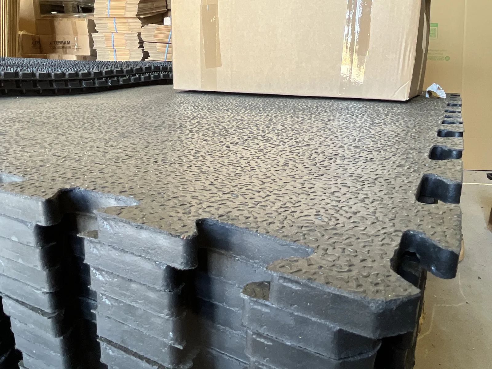 Stacked 17mm Amoebic Top Stable Mats showing thickness and edge profile